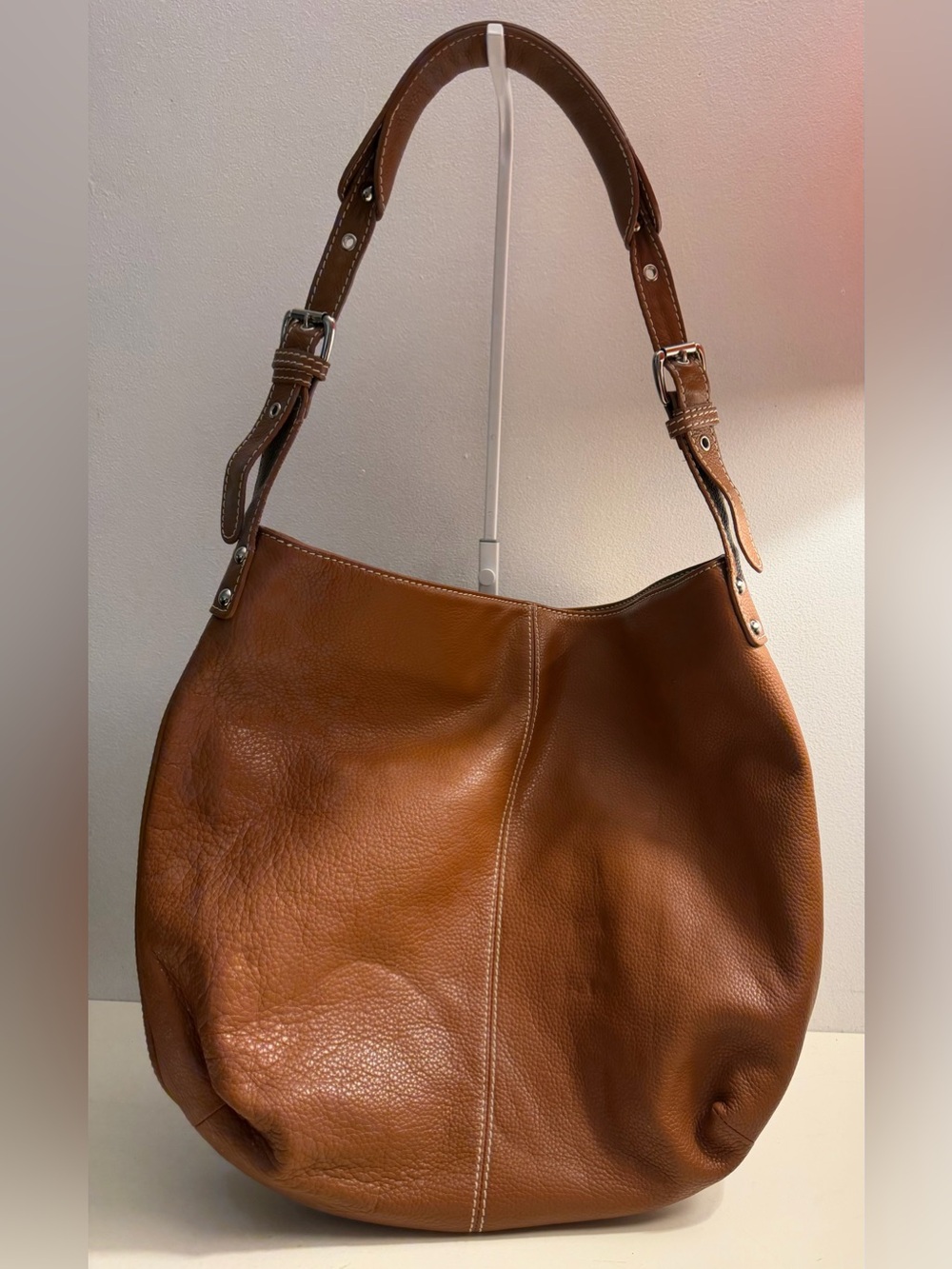 Tignanello large caramel colored pebbled leather hobo bag.